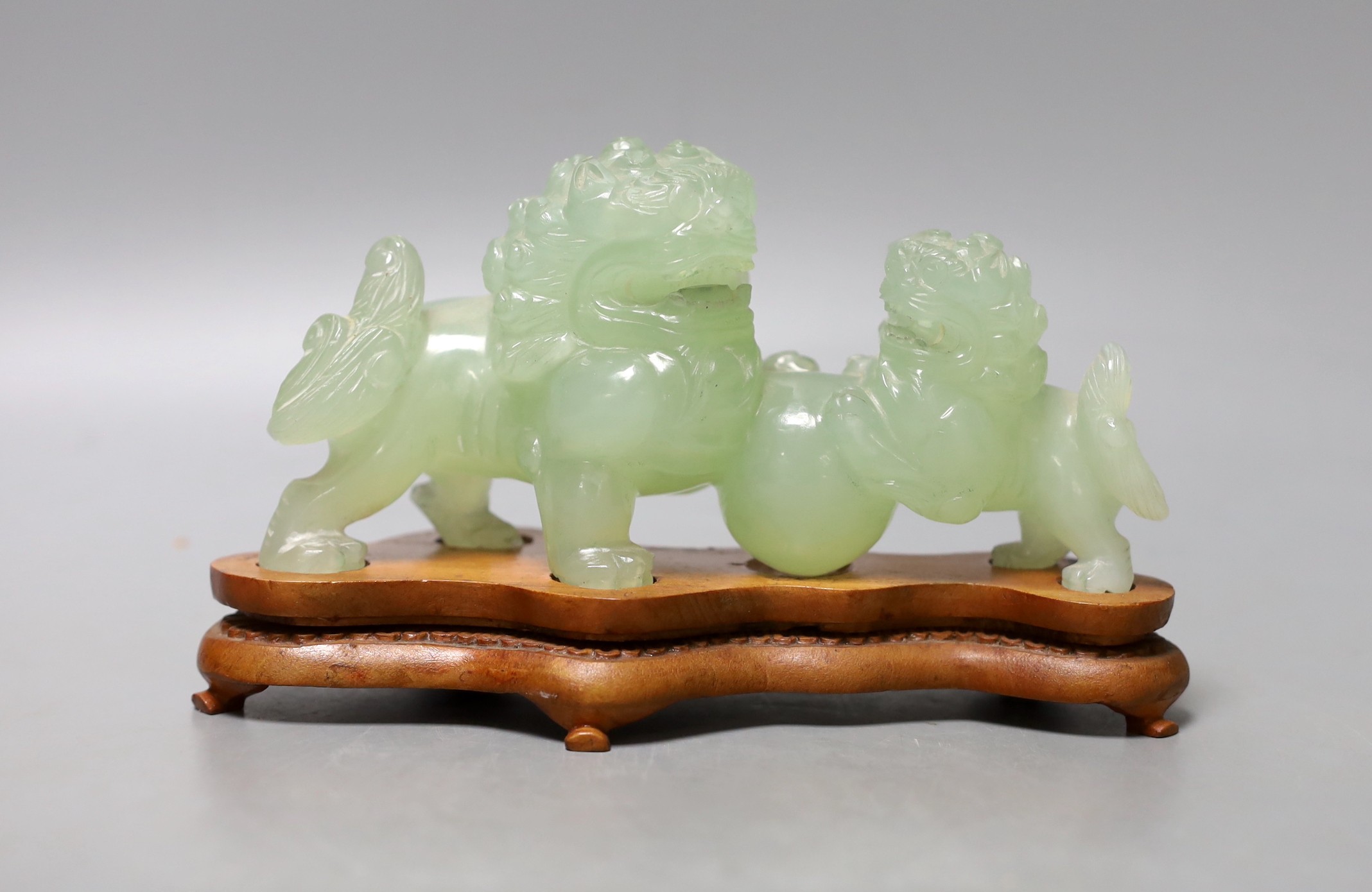 A Chinese bowenite lion group - 18cm long
